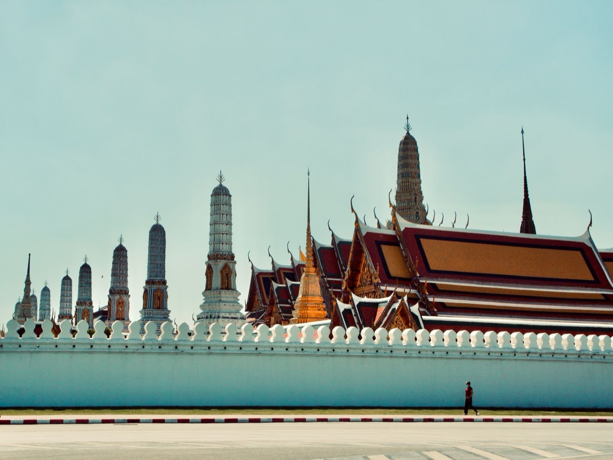 Thai urban skyline with modern buildings and traditional temples