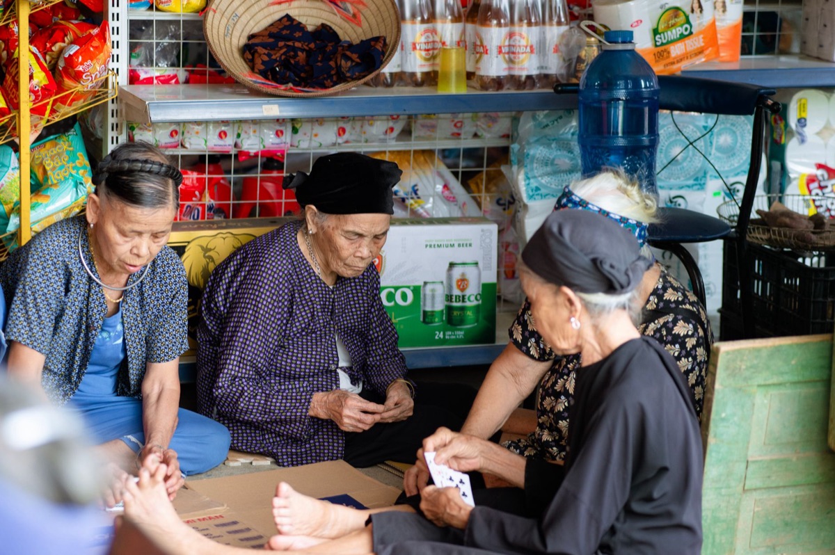 Senior citizen in Bangkok market shopping for goods